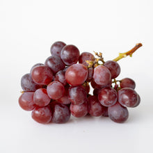 Load image into Gallery viewer, A cluster of dark red grapes with a small stem, photographed on a clean white background.